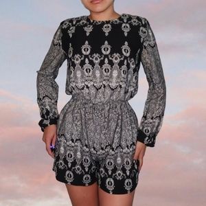 Super cute black and white Bohemian Romper with an open back